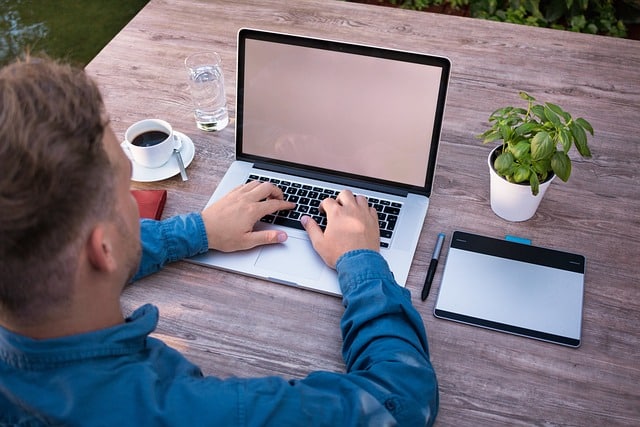 Man working on his laptop on how to start a profitable website